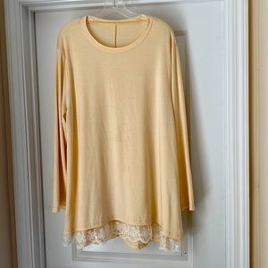 Pale yellow long sleeve tunic with lace at front hemline
